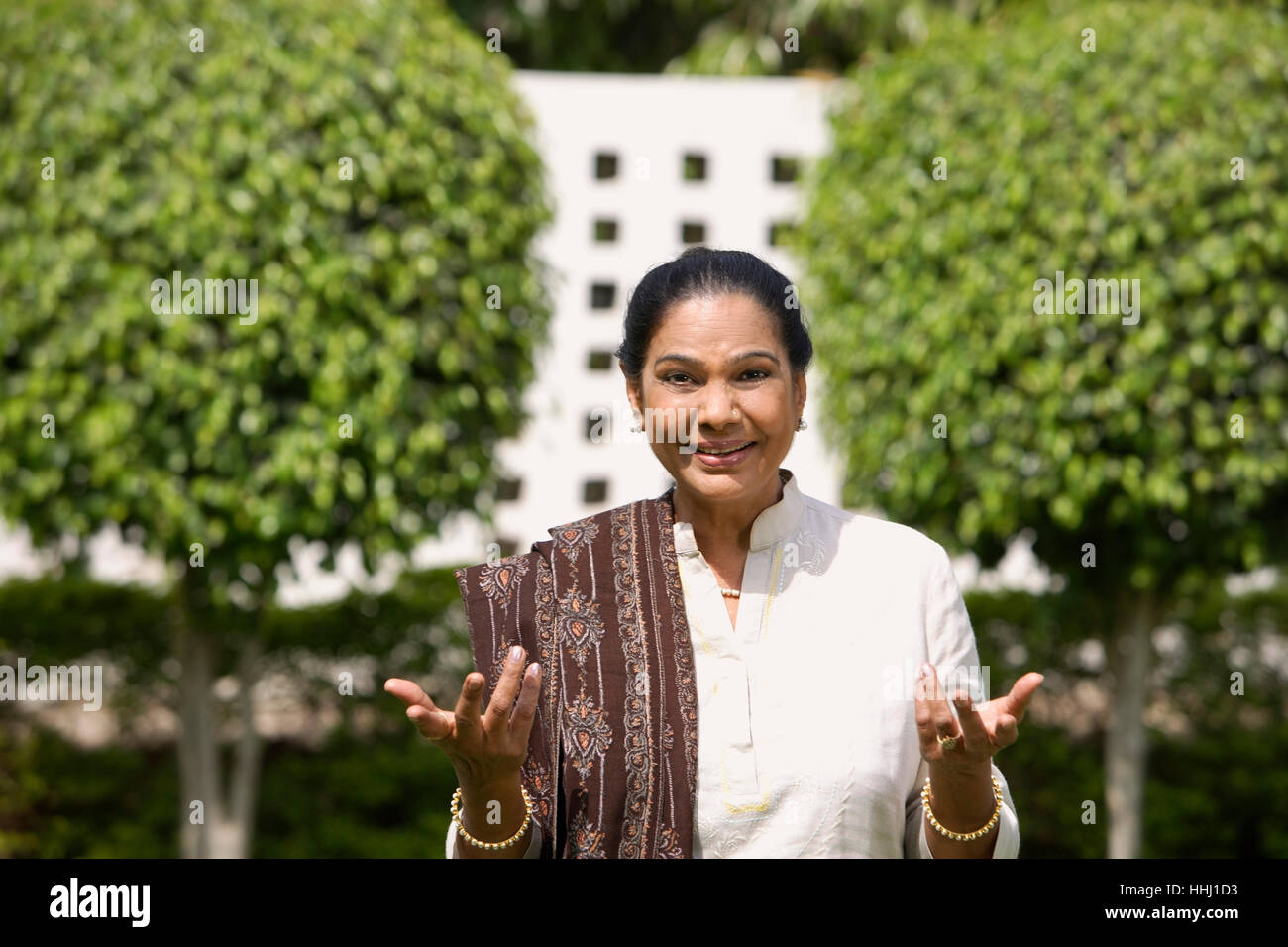 Smiling asian woman arms hi-res stock photography and images - Alamy