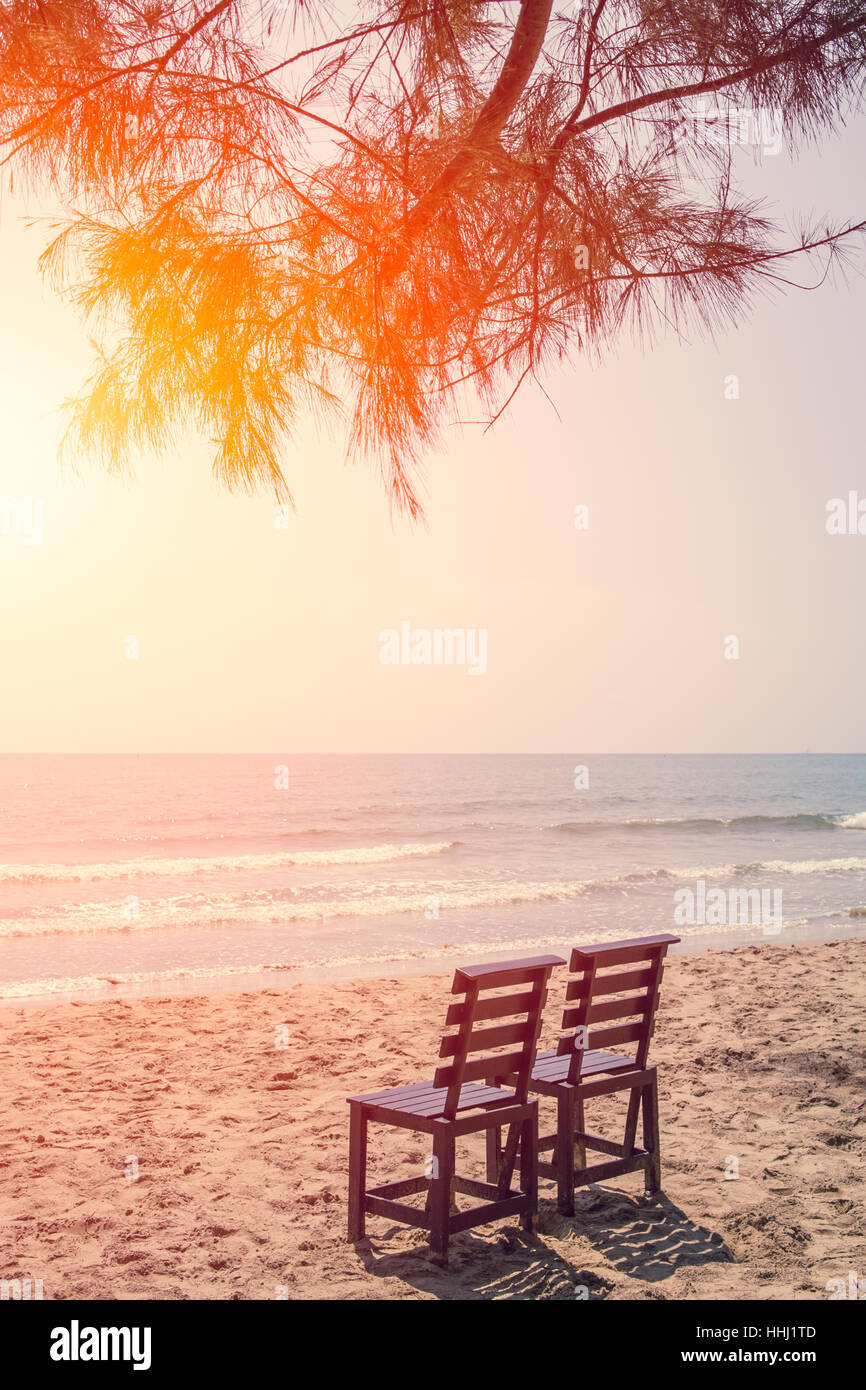 Empty Two Wood Chair on The Beach in Sunny day, Low Season Sea Travel No Tourist Concept. Stock Photo