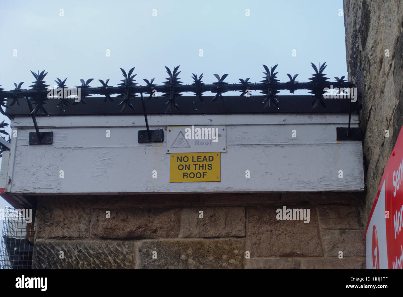 no lead on roof sign  barbed guards Stock Photo