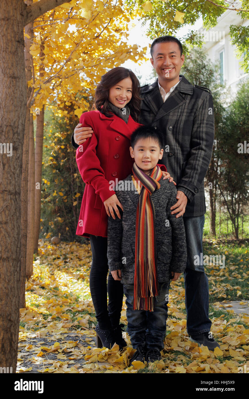Family with young boy standing outdoors Stock Photo - Alamy