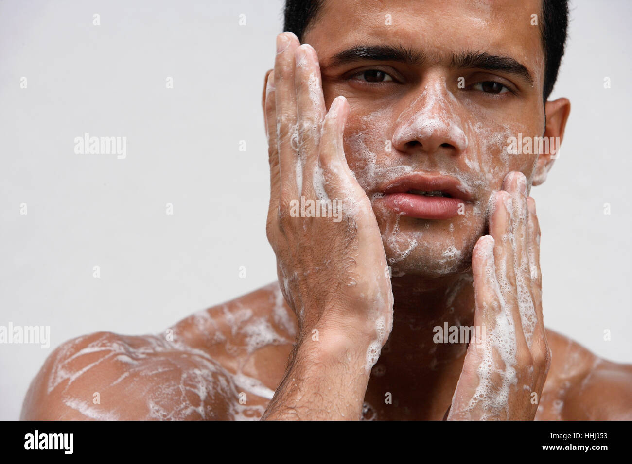 Man covering in soap suds Stock Photo Alamy