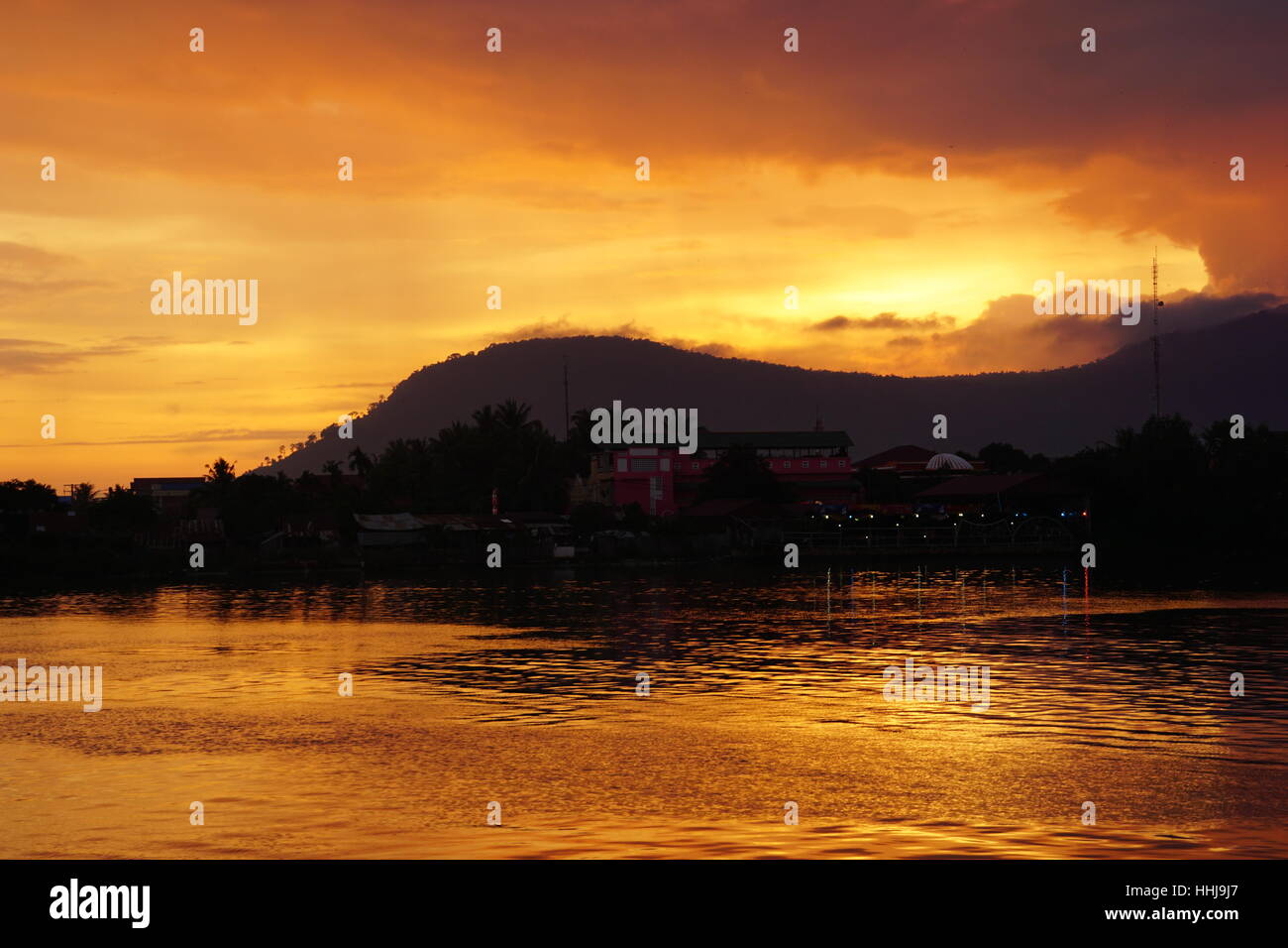 Sunset Behind Hills and Trees Kampot Cambodia Stock Photo