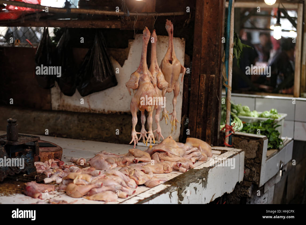 Chickens for sale in an Indonesian traditional market. Slaughtered and on display without refrigeration or ice. A vector for salmonella! Stock Photo