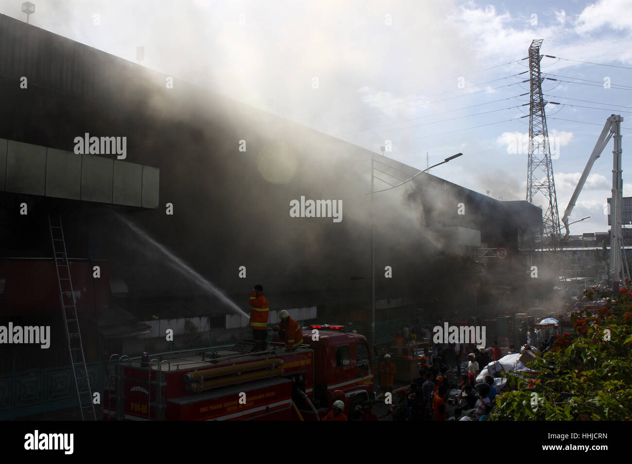 Jakarta, Indonesia. 19th January 2016. Firefighters trying to