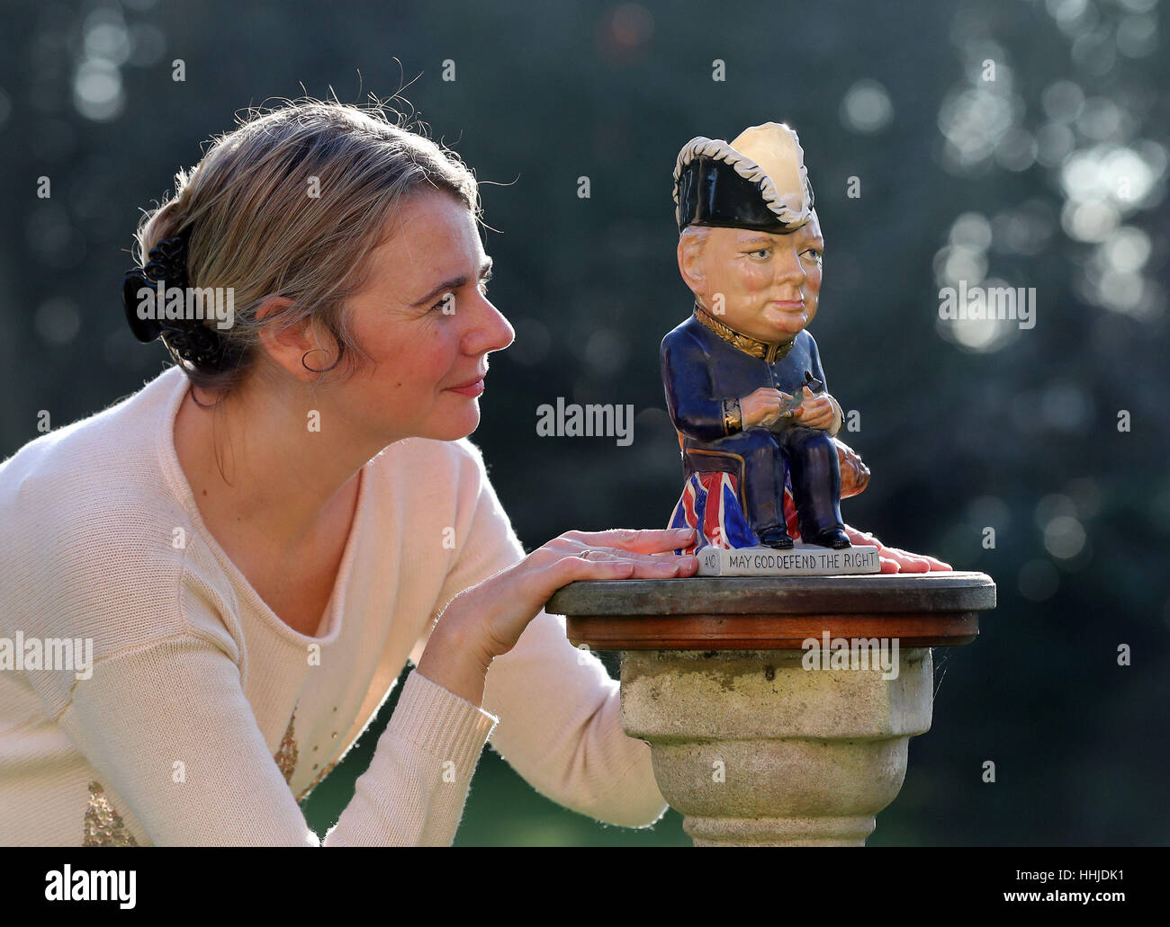 Auctioneer Catherine Southon checks a Clarice Cliff Churchill Toby jug, 1 of 350 ever produced dating from around 1940, which is estimated to sell for up to &pound;1,000 during an auction at Catherine Southon Auctioneers at Farleigh Court Golf Club in Surrey on February 22. Stock Photo