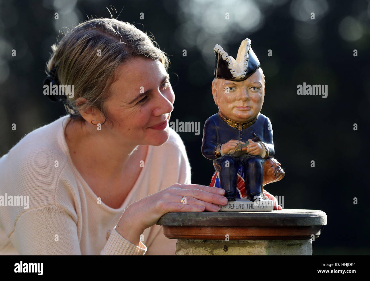 Auctioneer Catherine Southon checks a Clarice Cliff Churchill Toby jug, 1 of 350 ever produced dating from around 1940, which is estimated to sell for up to &pound;1,000 during an auction at Catherine Southon Auctioneers at Farleigh Court Golf Club in Surrey on February 22. Stock Photo
