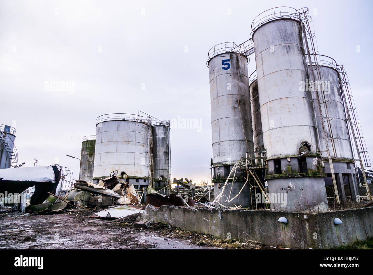 degradation of industrial materials, destroyed silos, twisted metal