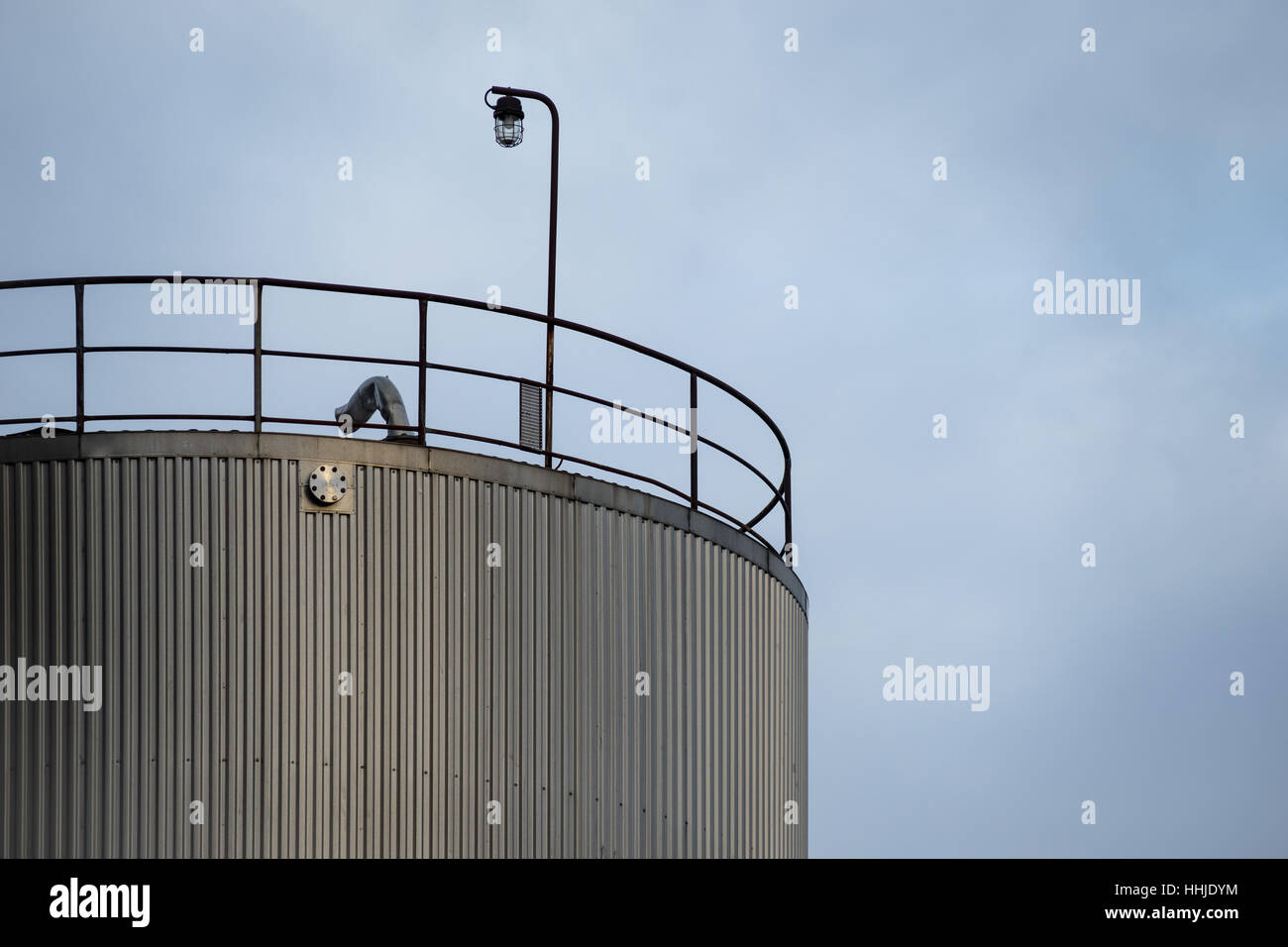 Industrial silos, tall and against the grey sky Stock Photo Alamy