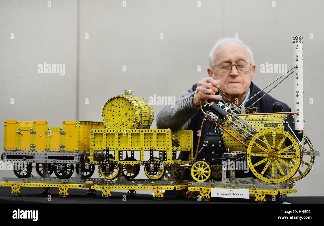 Colin Davies, 88, from Potters Bar in Hertfordshire, checks the fittings on his Meccano model of George Stephenson's Rocket ahead of the London Model Engineering exhibition held at Alexandra Palace, London, between Friday January 20 and Sunday January 22. Stock Photo