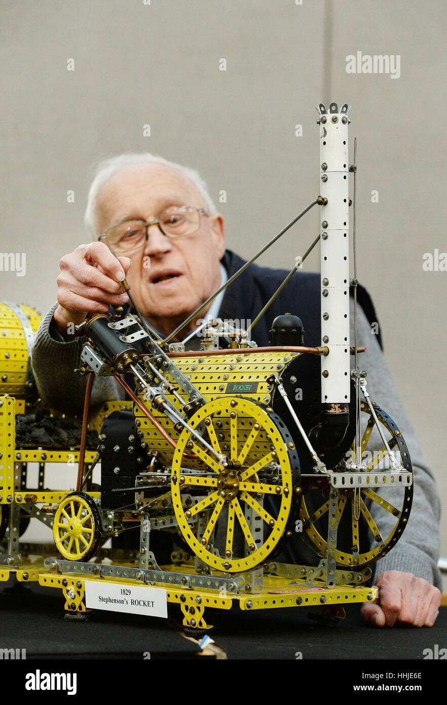 Colin Davies, 88, from Potters Bar in Hertfordshire, checks the fittings on his Meccano model of George Stephenson's Rocket ahead of the London Model Engineering exhibition held at Alexandra Palace, London, between Friday January 20 and Sunday January 22. Stock Photo