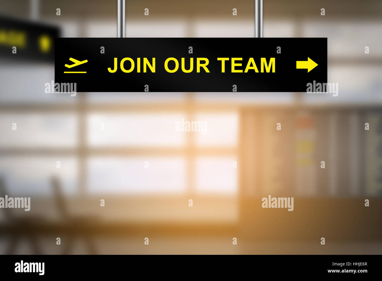 join our team on airport sign board with blurred background and copy space Stock Photo