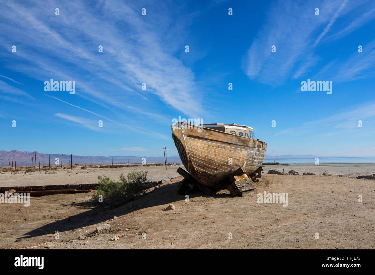 Desert landscape abandoned boat at Bombay Beach at the Salton Sea in California desert Stock Photo