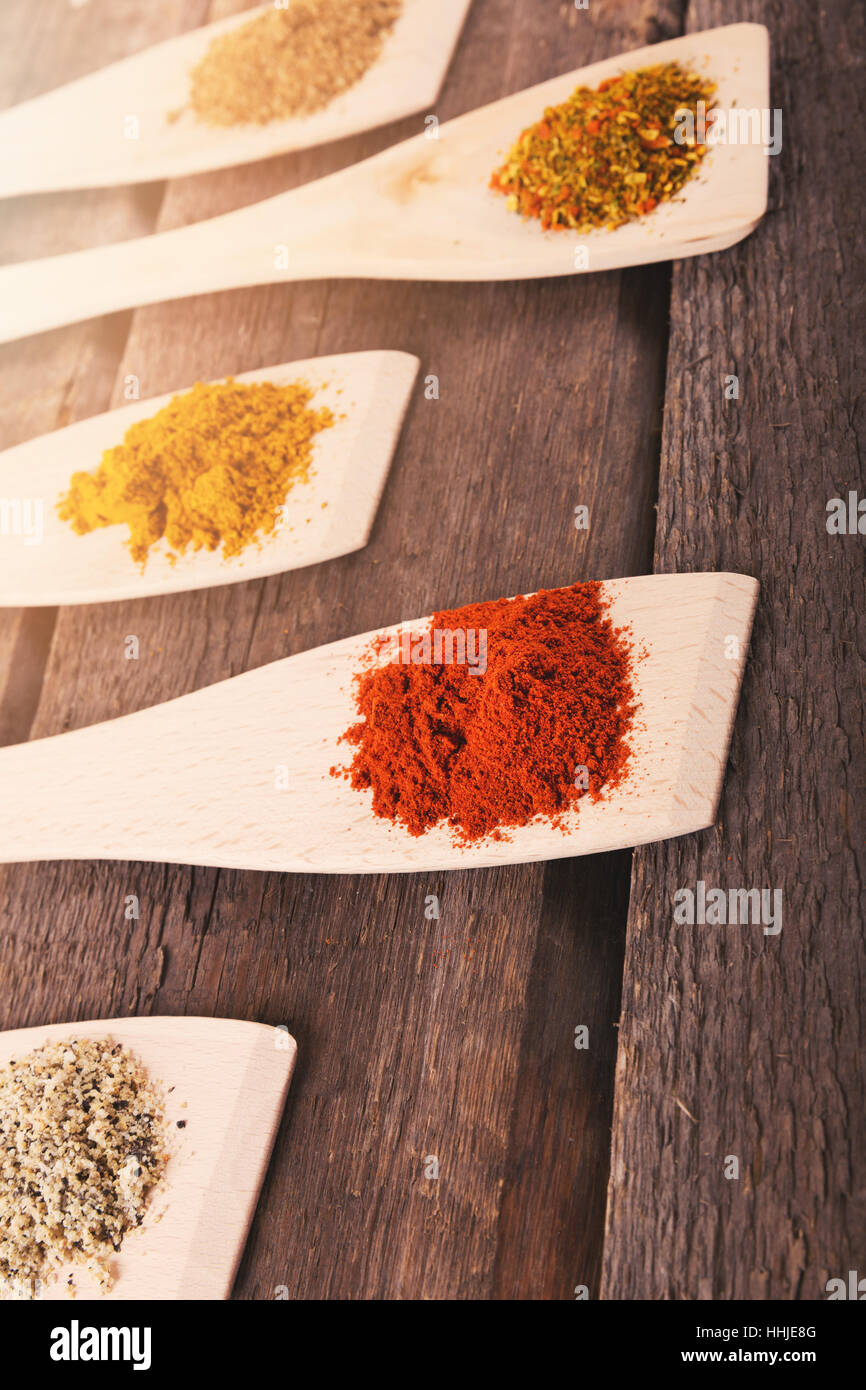 mix of spices on wooden spoons Stock Photo Alamy