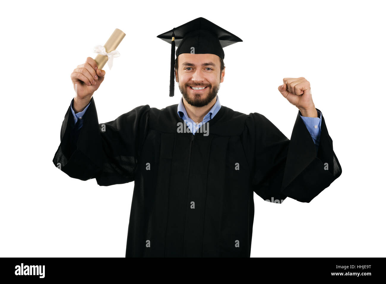 cheerful smiling male graduate wearing gown and cap isolated on white Stock Photo