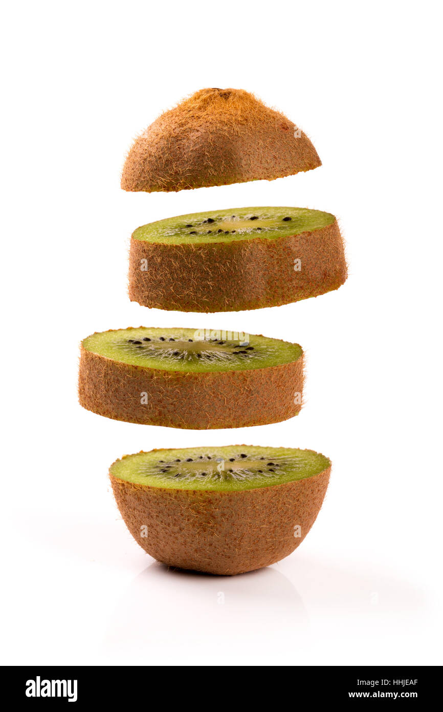 kiwi slices levitating on white background Stock Photo