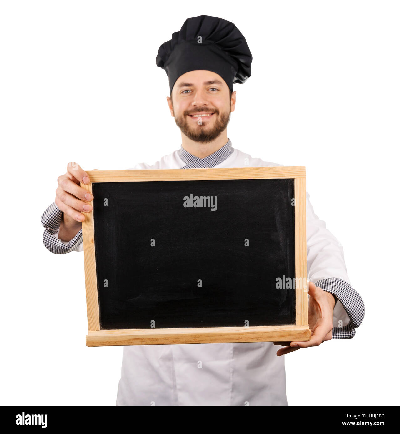 smiling chef holding blank blackboard in front Stock Photo