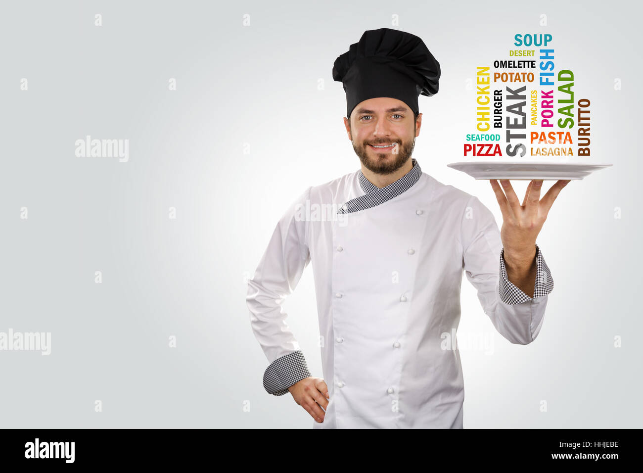 chef holds a plate with different food names. copy space Stock Photo