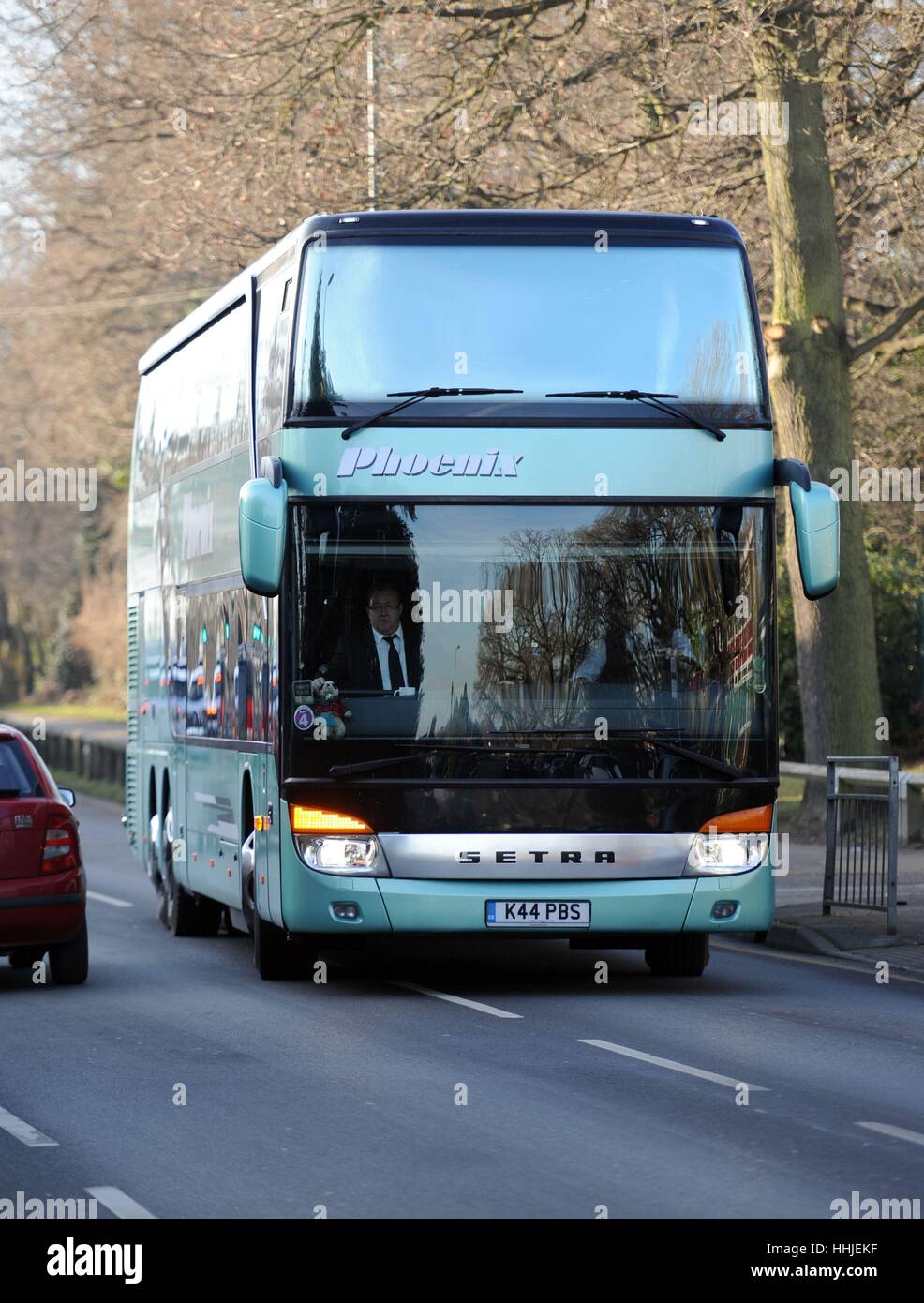 Status Quo band members arrive in their tour bus at Woking Crematorium
