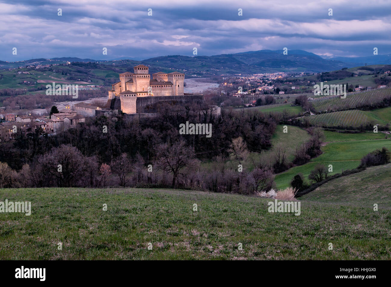 Torrechiara Castle at twilight in a cloudy day Stock Photo