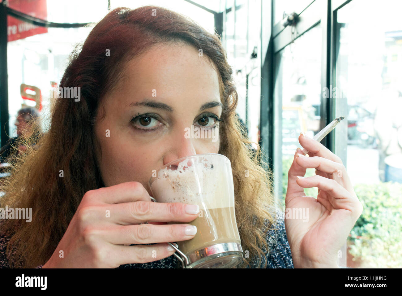 Portrait Woman with Cigarette Drinking a Coffee. Stock Photo