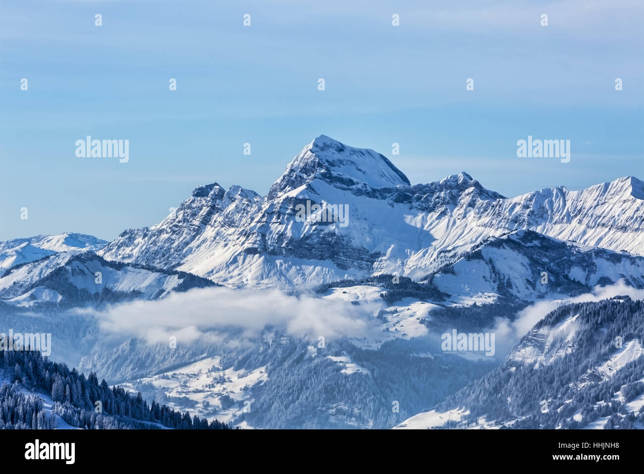 Beautiful winter landscape in the Mont Blanc Massif with the view to the Chaine des Aravis above the clouds. Stock Photo