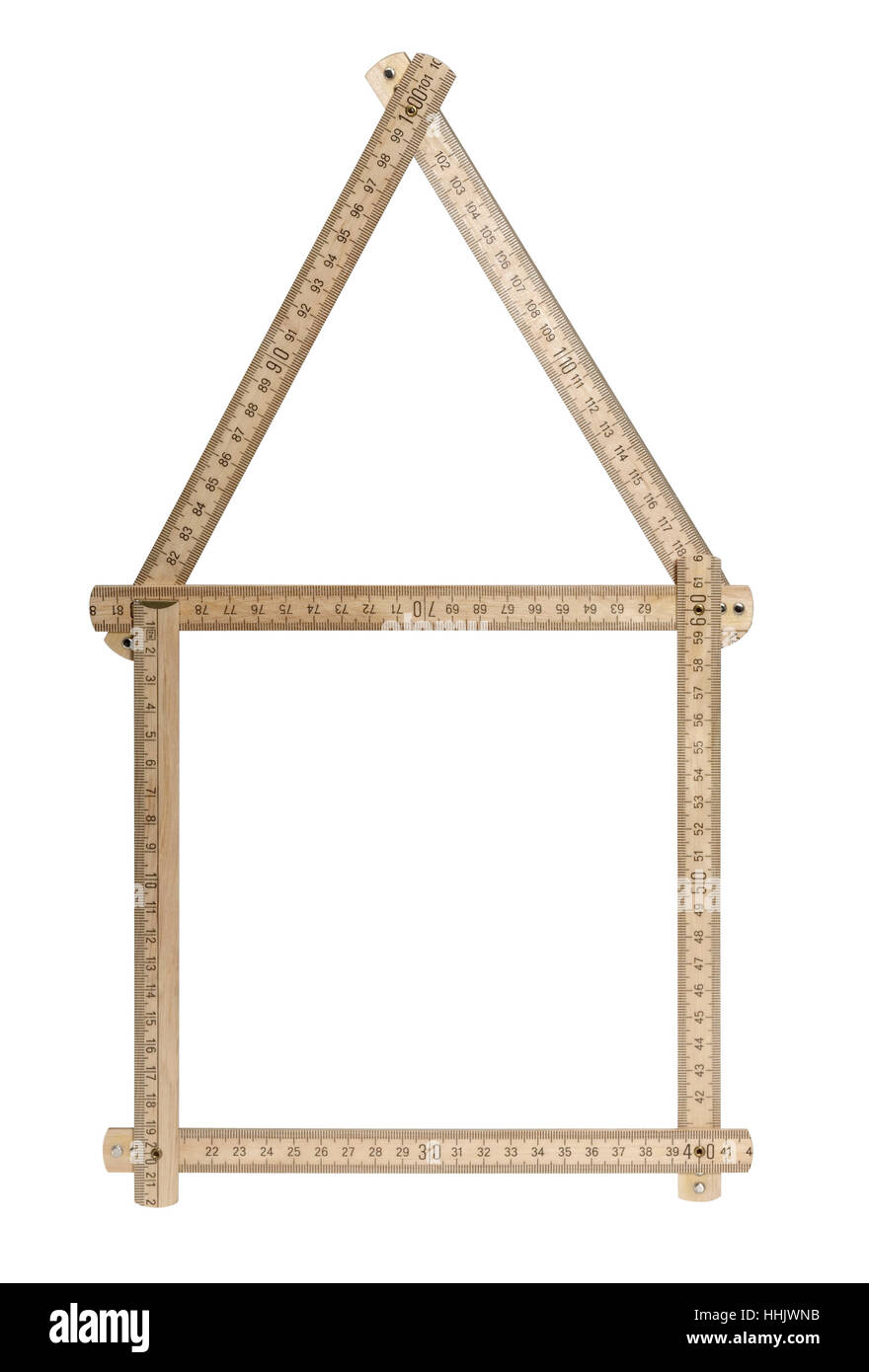 studio photography showing a wooden yard stick shaped like a symbolic house. Isolated on white with clipping path Stock Photo