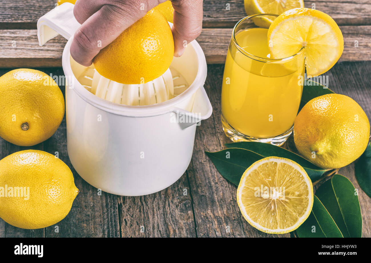 Squeezing lemon juice Stock Photo Alamy