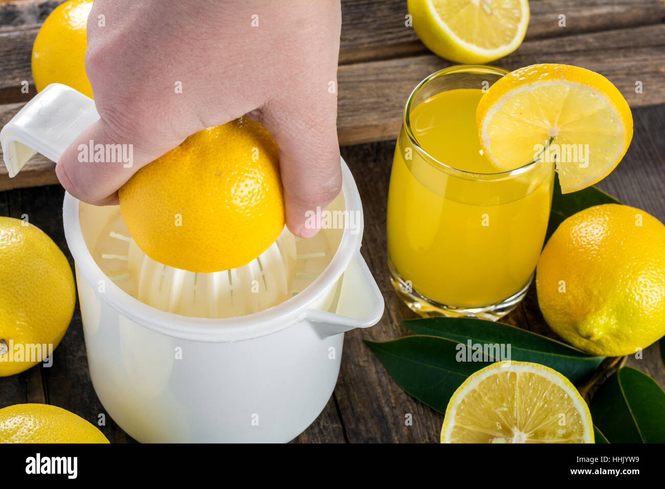 Squeezing lemon juice Stock Photo Alamy
