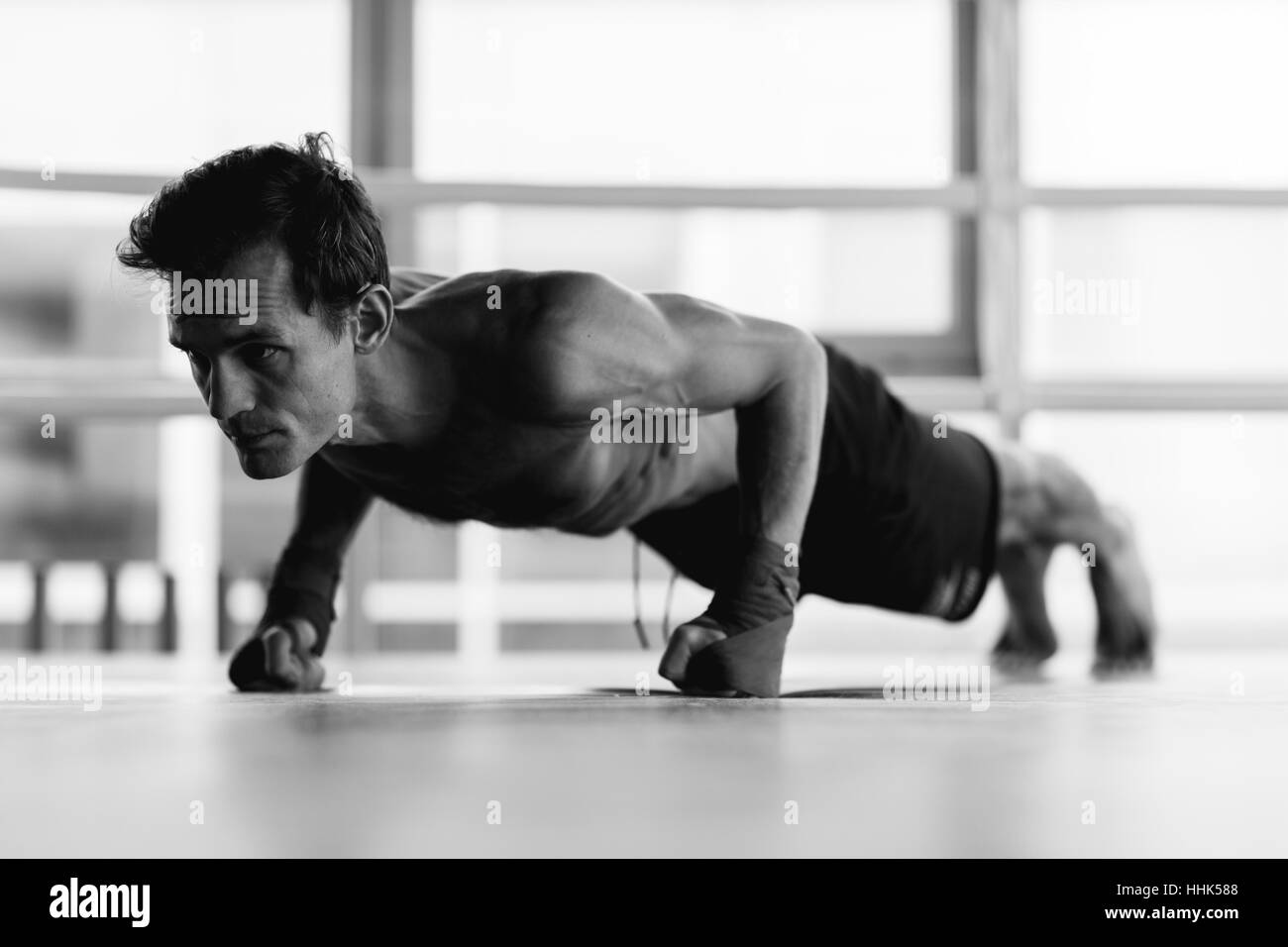 Photo of athlete performs exercises Stock Photo