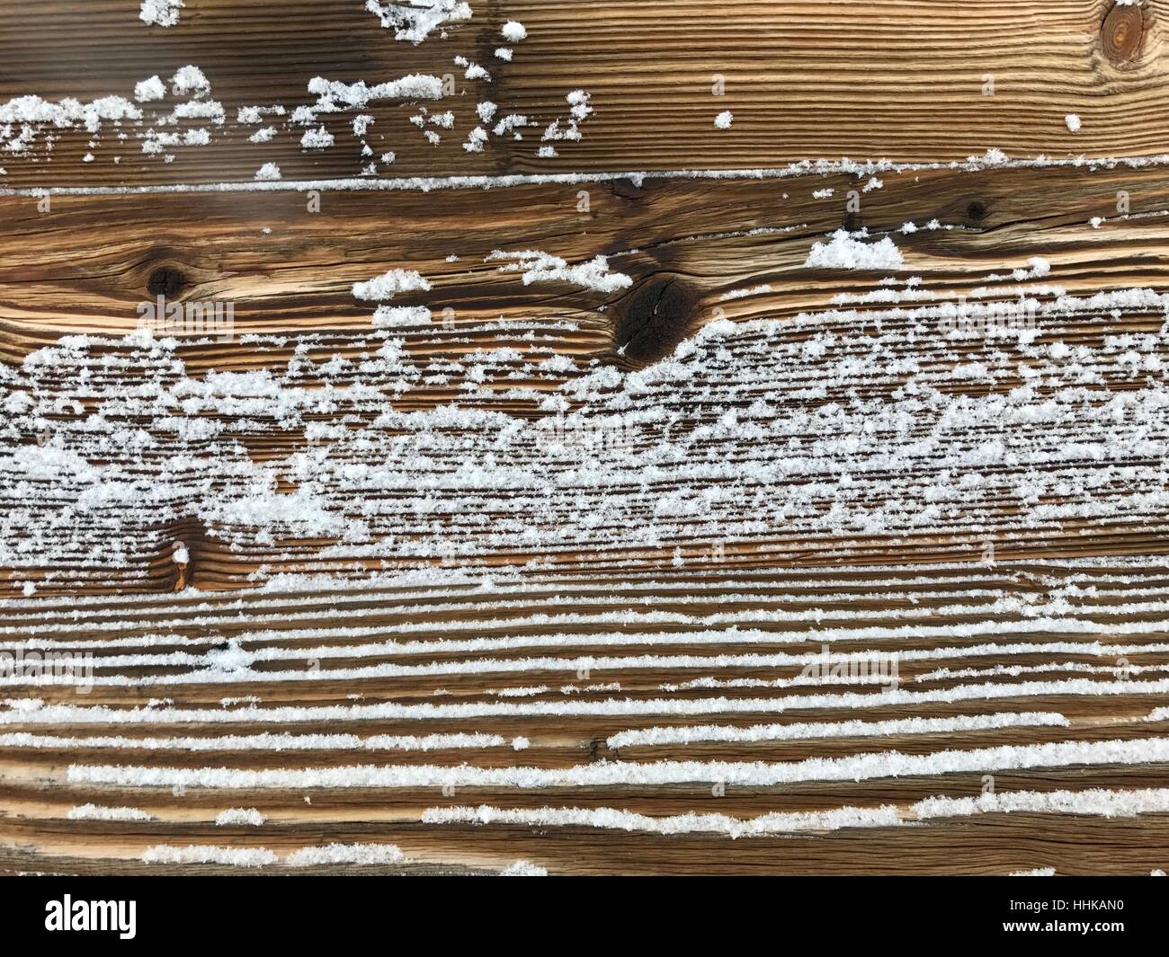 old wood wall covered with snow vintage retro natural outdoor