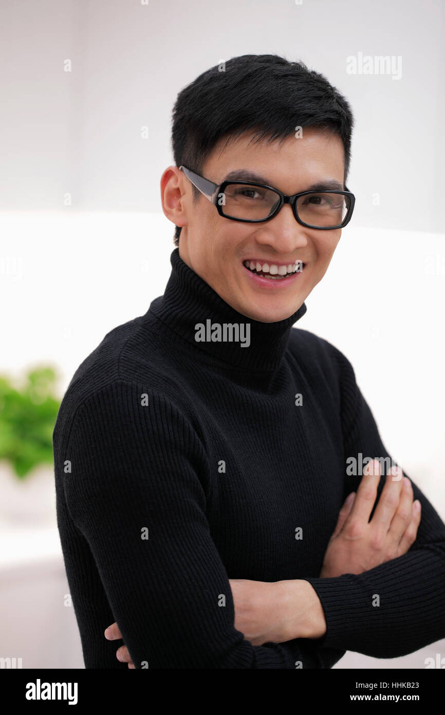 Head shot of young man wearing glasses and smiling Stock Photo - Alamy