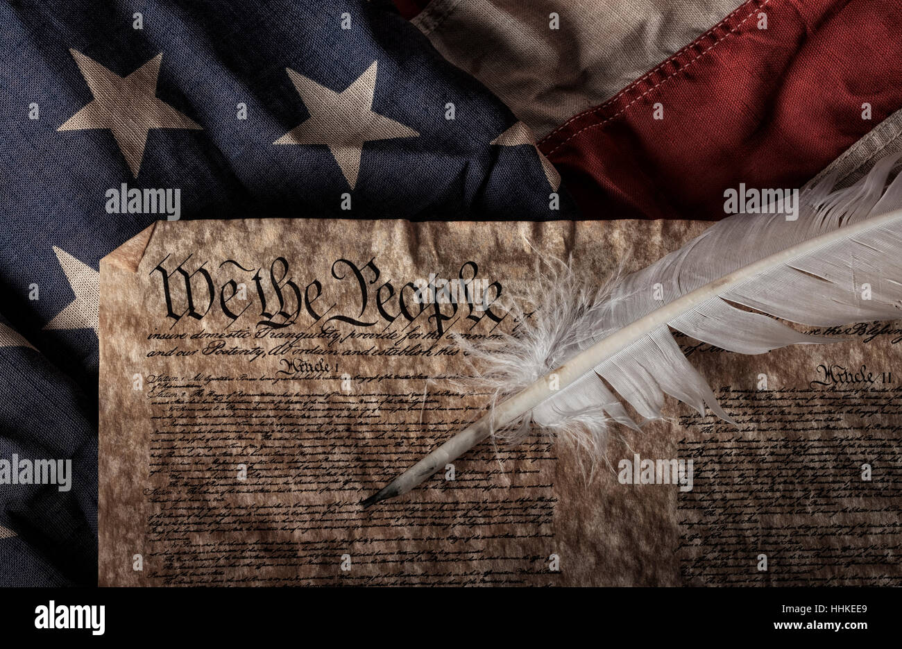 U.S. constitution on an old and worn flag Stock Photo