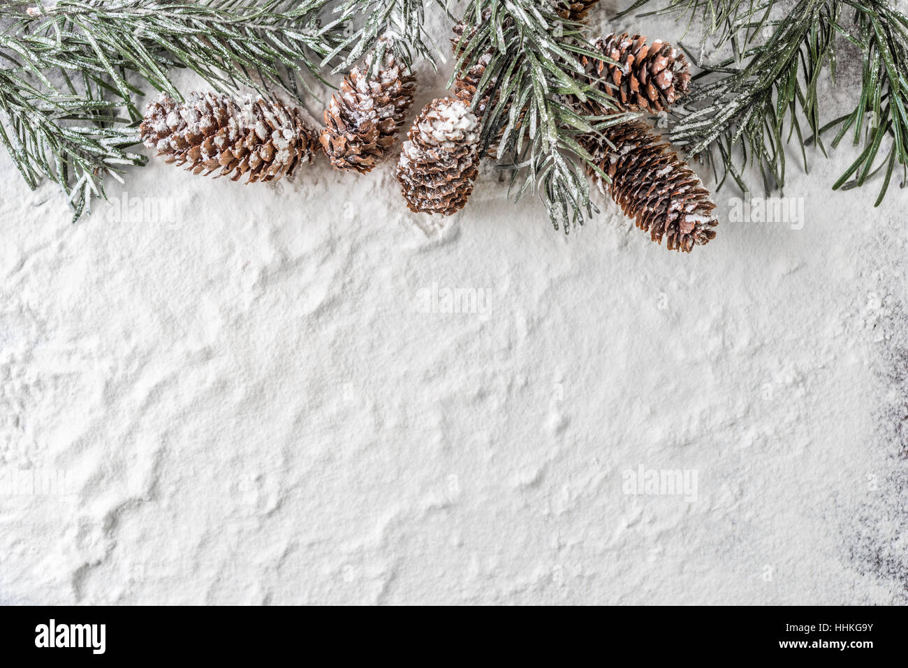 snow background with snowy fir branch and pine cones Stock Photo - Alamy