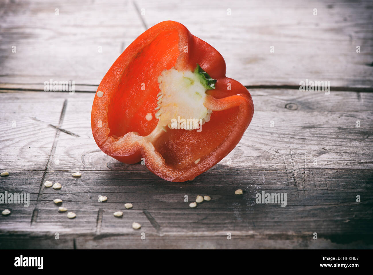 sweet red bell pepper on a wooden table Stock Photo