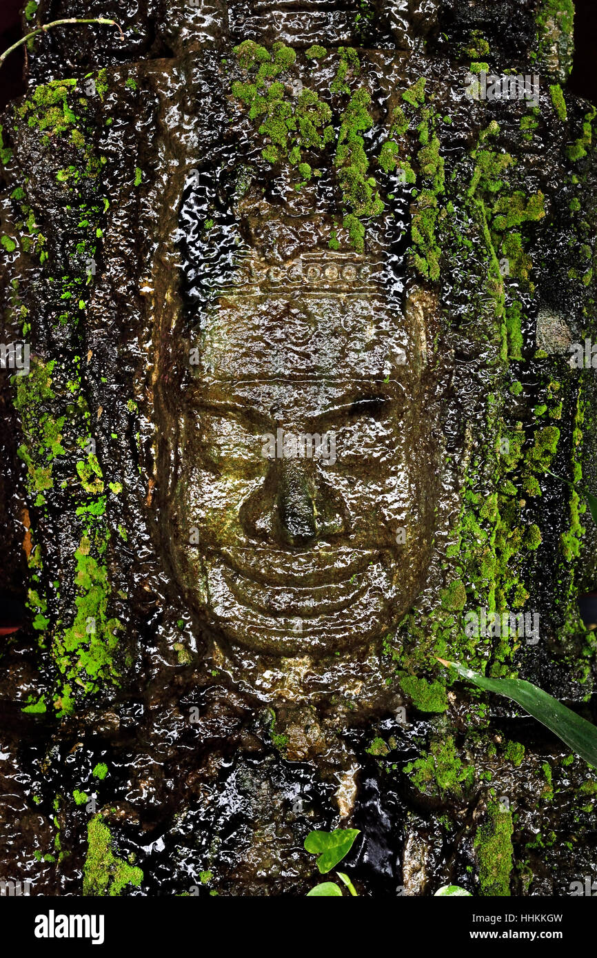 Water Fountain green wet  Buddha Face Phnom Penh City Center Cambodia Stock Photo