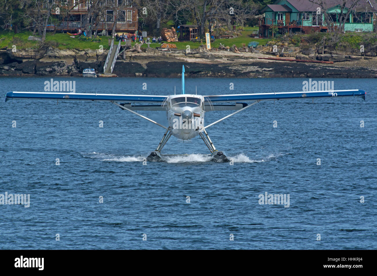 Harbour Air float plane approaching its berthing pontoon at Nanaimo, Vancouver Island, BC Canada. SCO 11,685. Stock Photo