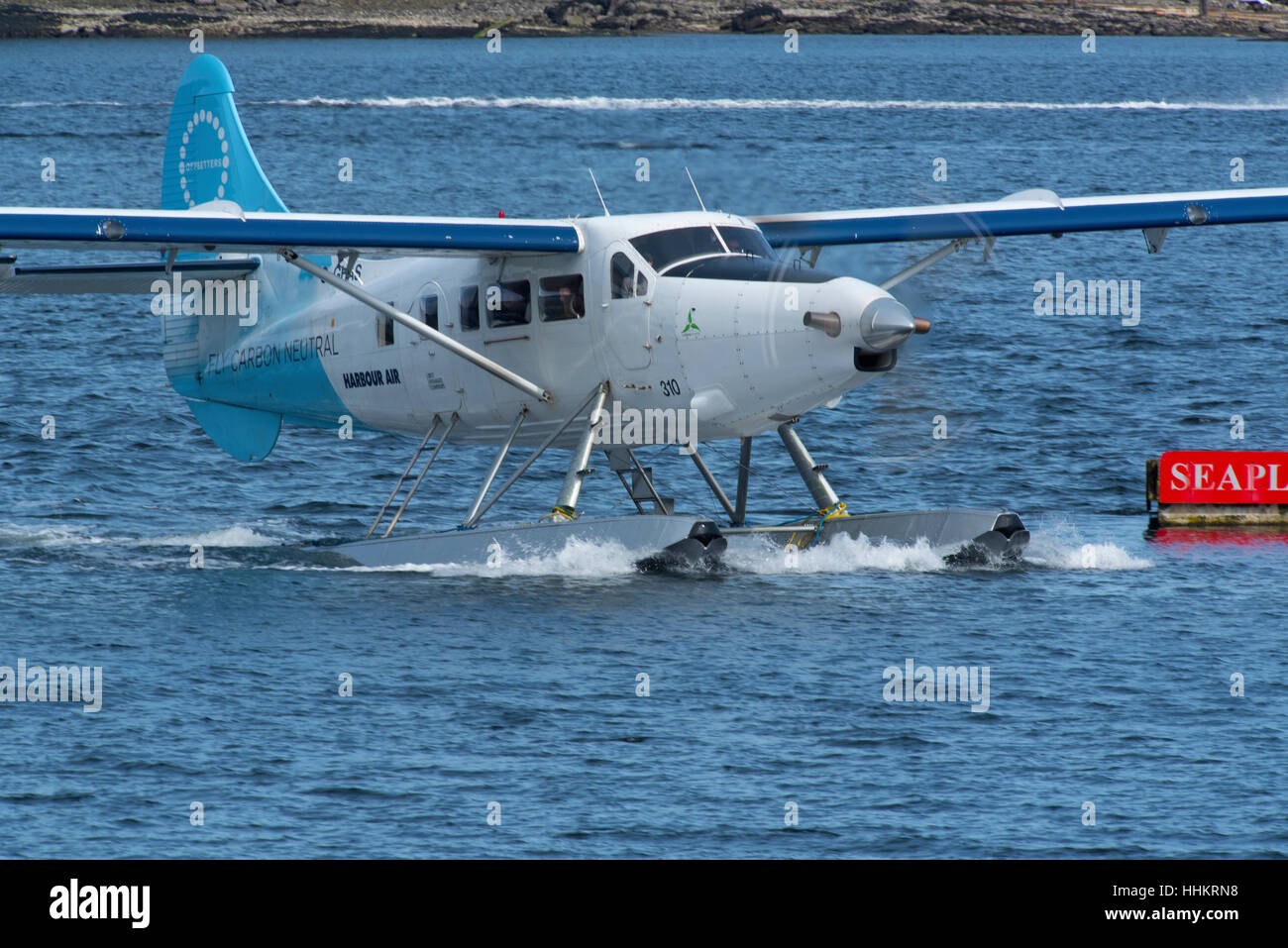 Harbour Air float plane approaching its berthing pontoon at Nanaimo, Vancouver Island, BC Canada. SCO 11,686. Stock Photo