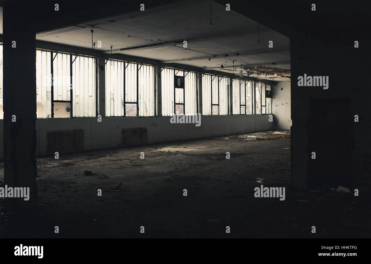 Interior of an old factory, abandoned and ruined building. Stock Photo