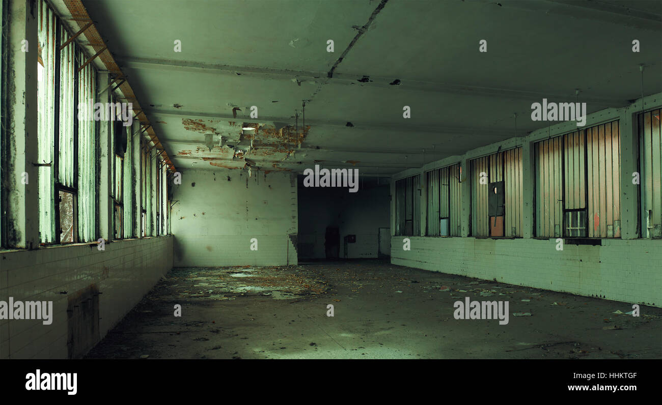 Interior of an old factory, abandoned and ruined building. Stock Photo