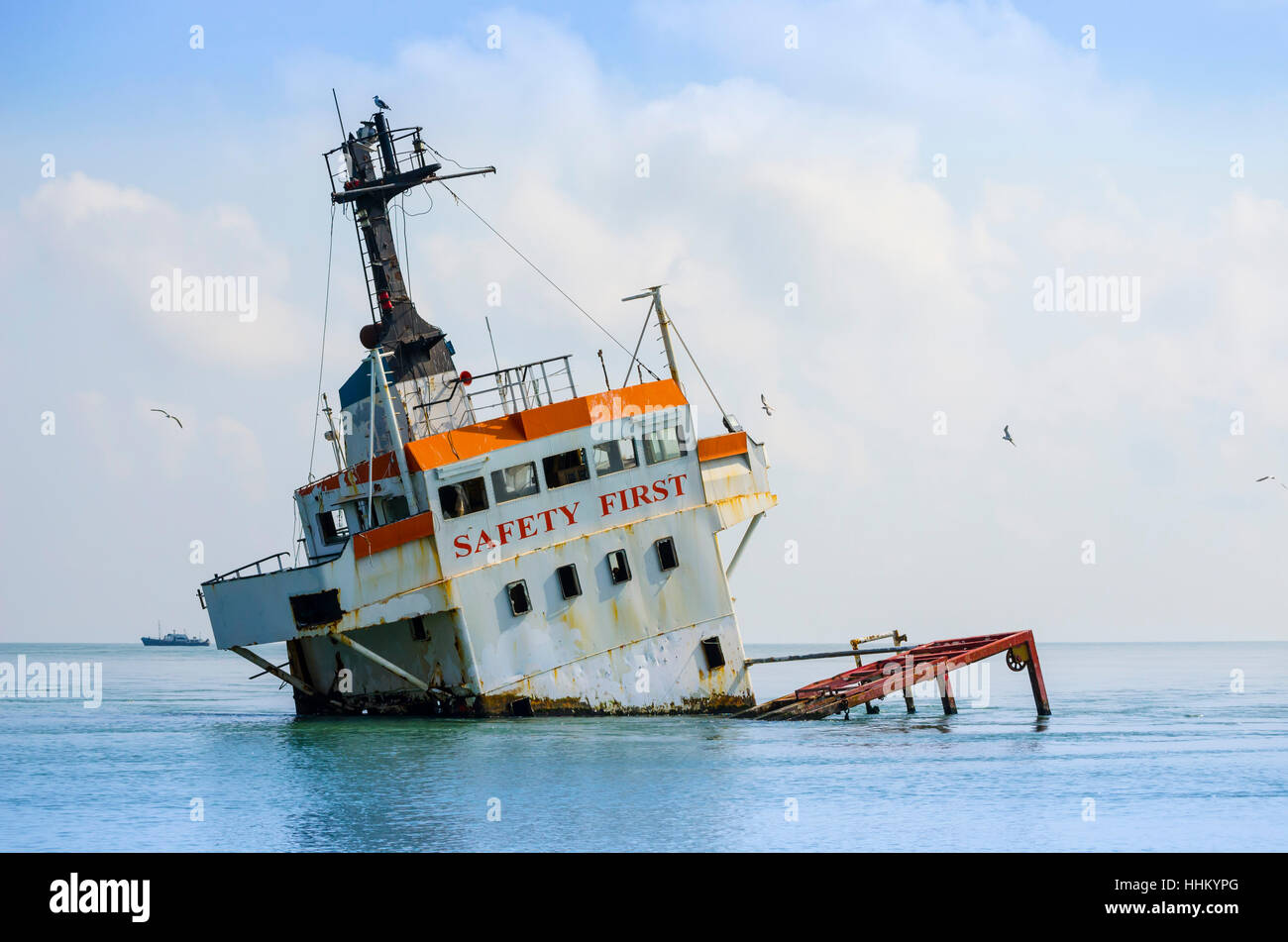 shipwreck, sinking cargo ship in the middle of the sea Stock Photo