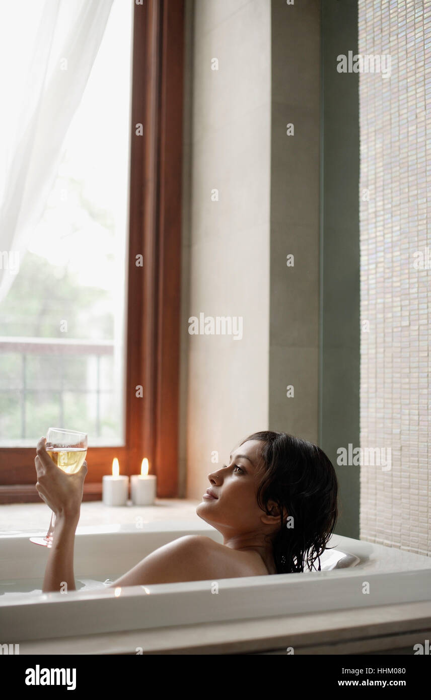 woman in bathtub with glass of wine Stock Photo Alamy