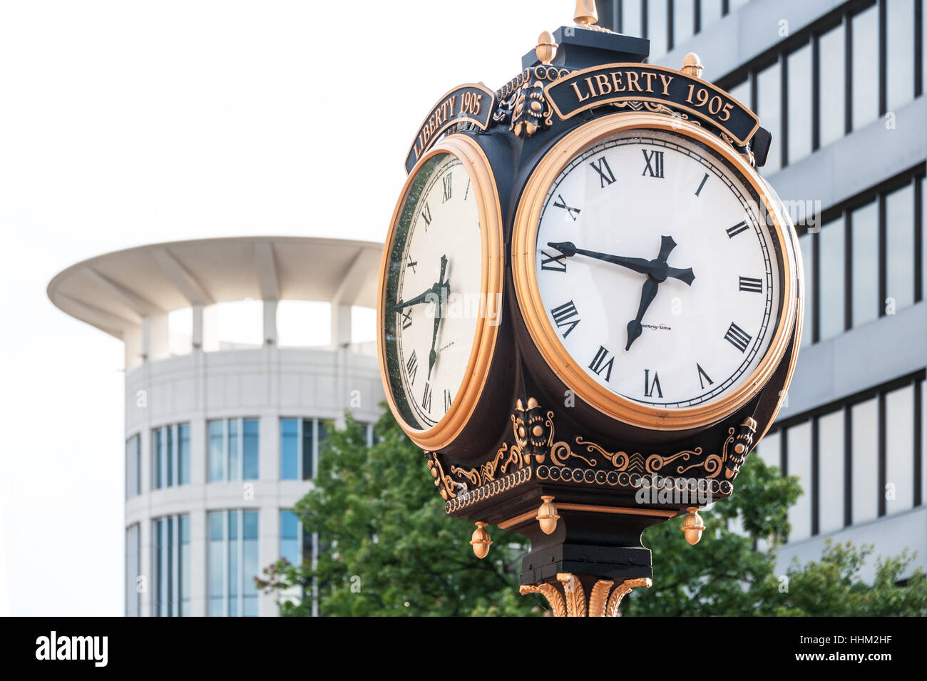 Vintage clock on Main Street in historic downtown Greenville, North Carolina, USA. Stock Photo