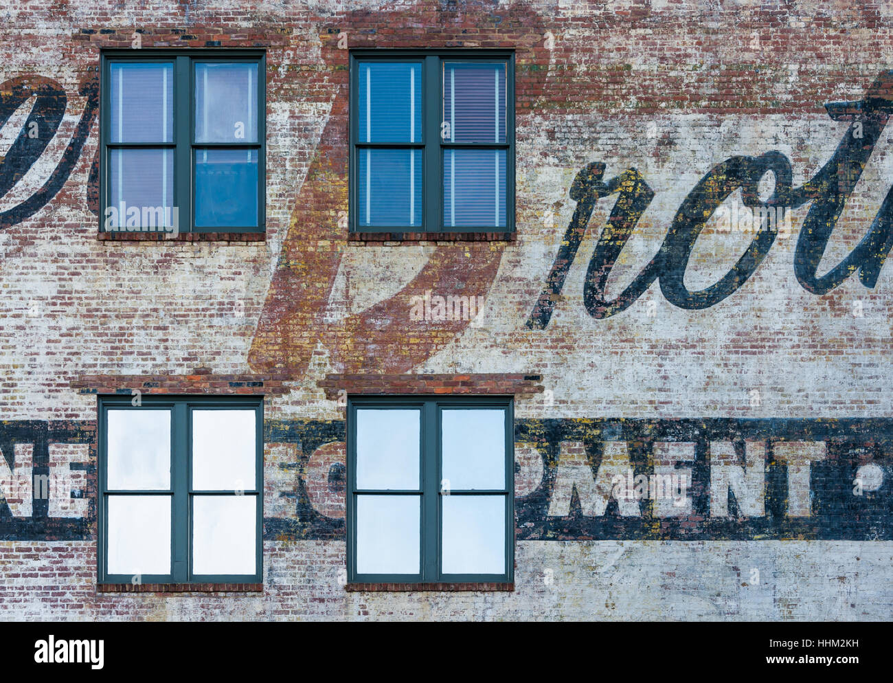 Painted brick wall on building along Main Street in the West End Historic District of downtown Greenville, South Carolina, USA. Stock Photo