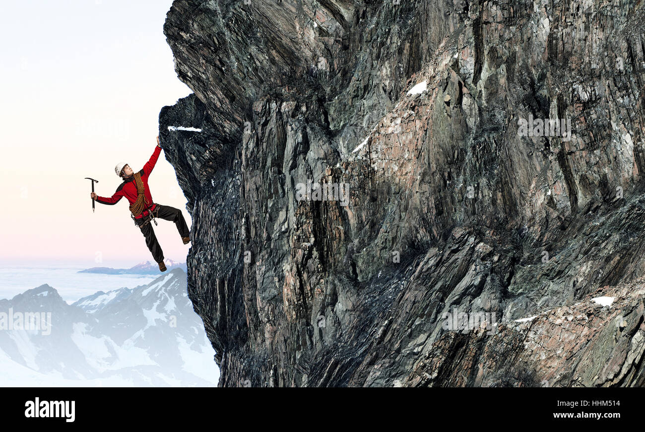 Young brave man alpinist climbing dangerous cliff Stock Photo Alamy