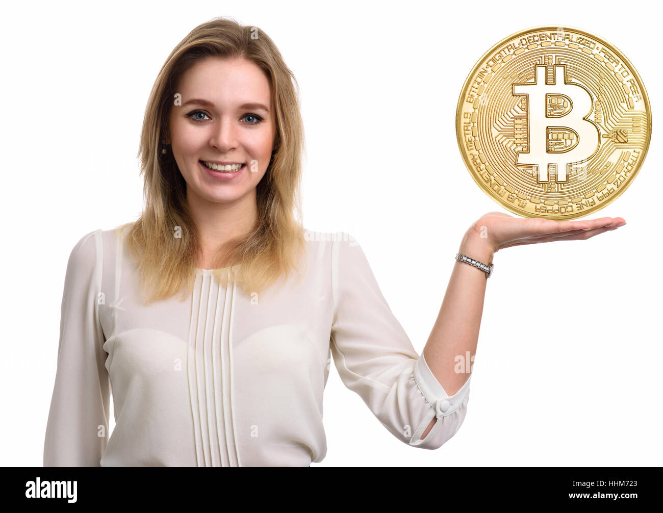 Beautiful woman showing Golden Bitcoin coin. Virtual money concept. Cryptocurrency Stock Photo