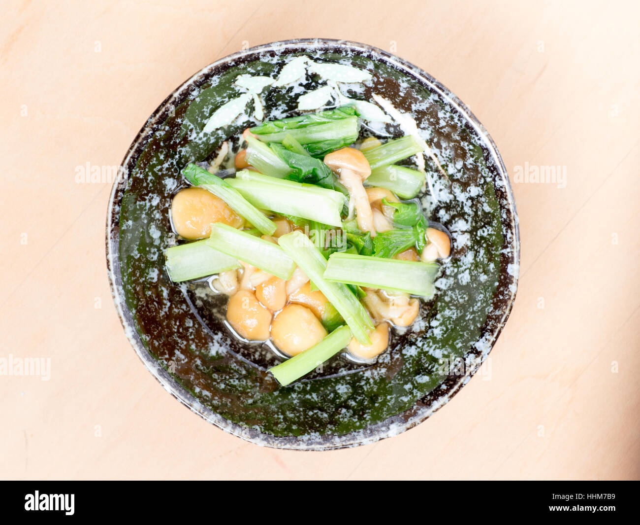 Japanese cuisine, slimy mushroom called nameko and spinach in the bowl Stock Photo
