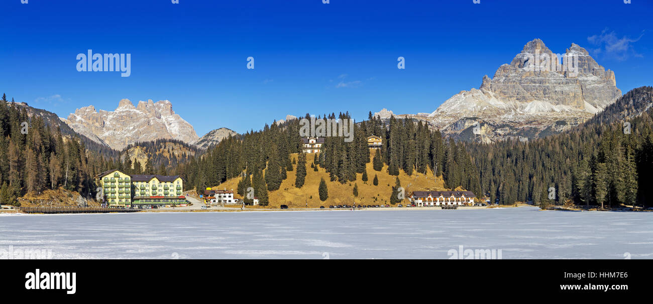 Panoramic views of the frozen lake Misurina and Tre Cime di Lavaredo in Background Stock Photo