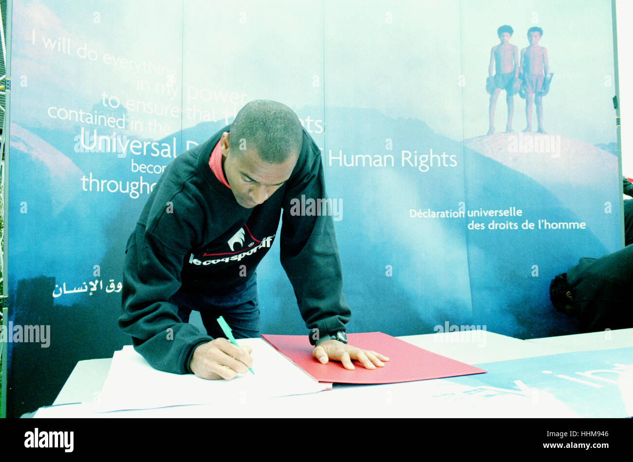 Charlton Athletic forward Mark Bright signing up the the universal declaration of human rights in 1998 Stock Photo