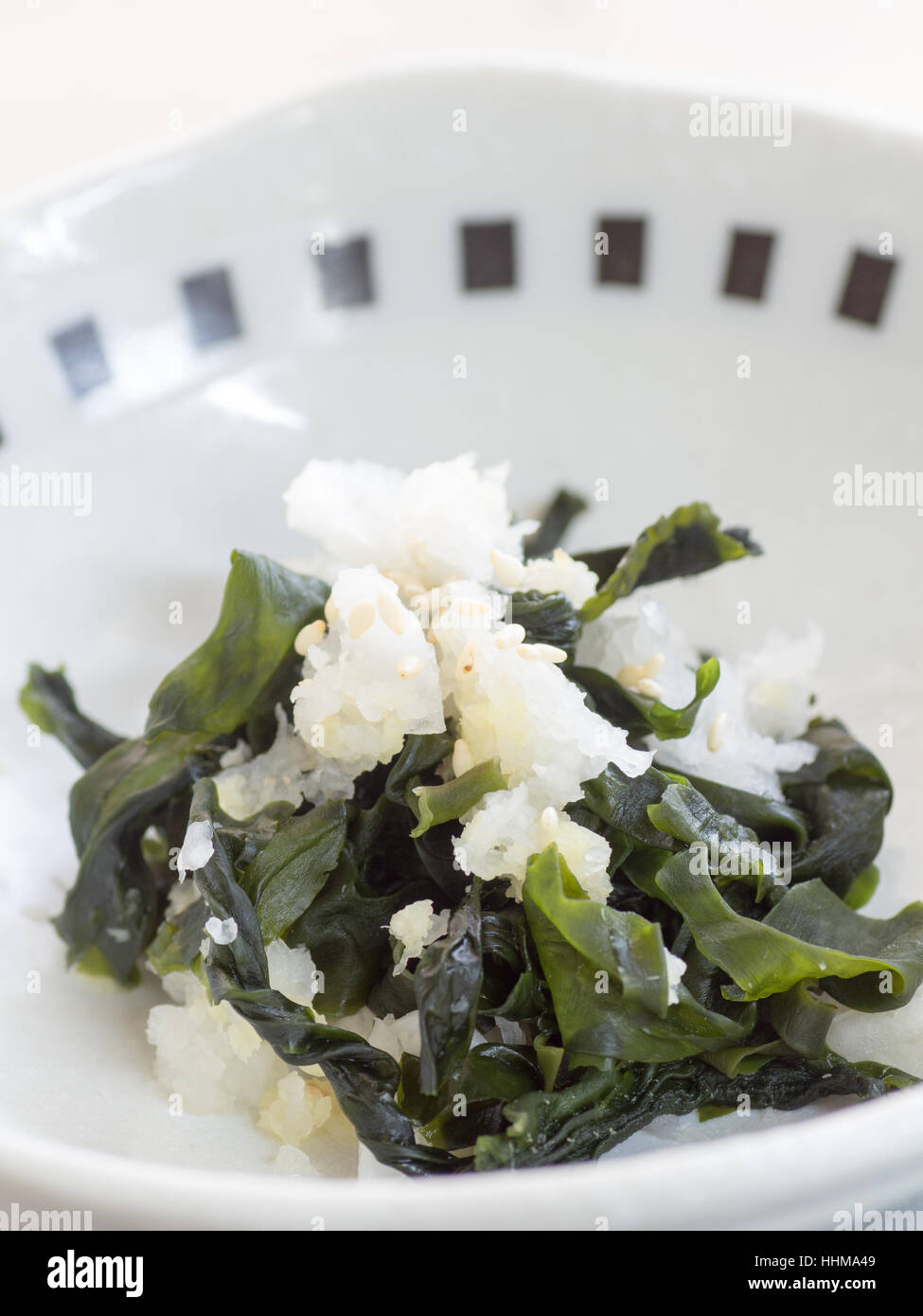 Japanese cuisine, sea weeds and grated Japanese daikon radish salad in the bowl Stock Photo