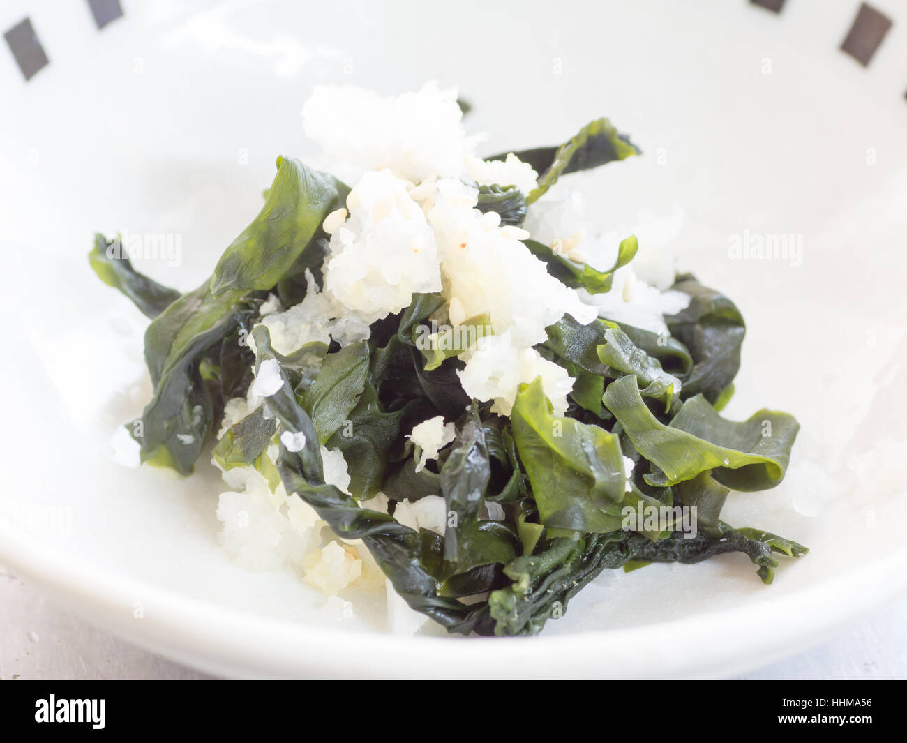 Japanese cuisine, sea weeds and grated Japanese daikon radish salad in the bowl Stock Photo